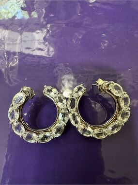 Silver with Rhodium plated forward facing hoops. White Topaz oval  stone